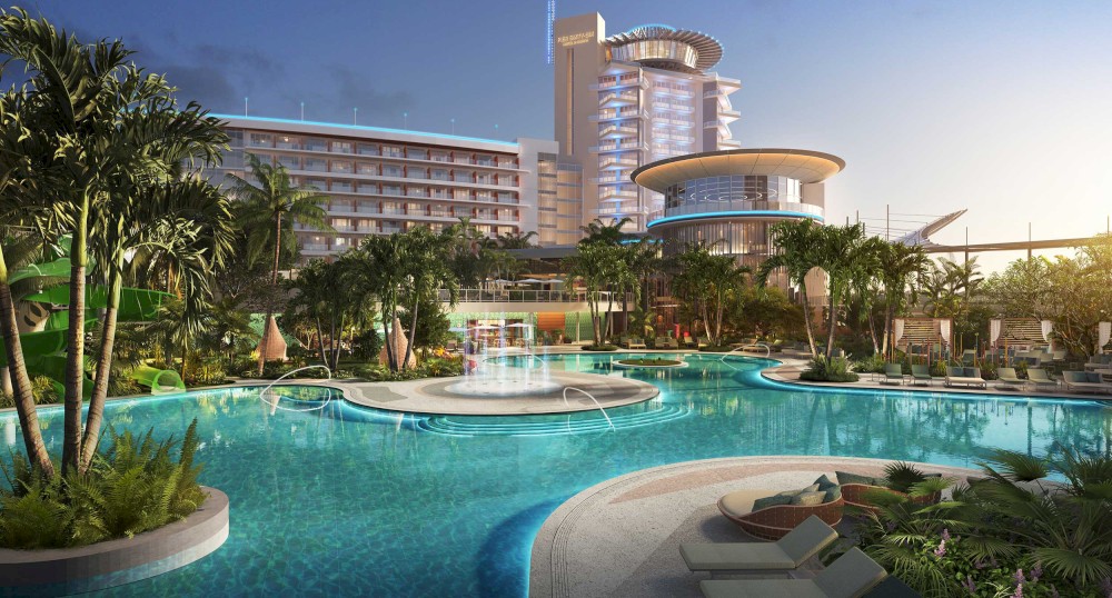 The image shows a luxurious resort with a large pool, lounge chairs, palm trees, and modern buildings in the background, featuring a tropical ambiance.